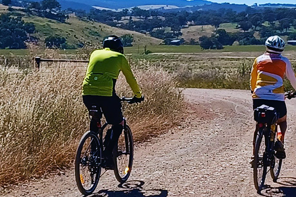 Two cyclists on the Molong to Cargo leg of the Orange and Villages Bicycle Trail 