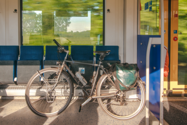 Bicycle in vestibule of fast moving train