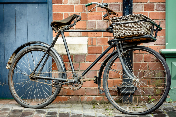 Vintage bike standing against brick wall