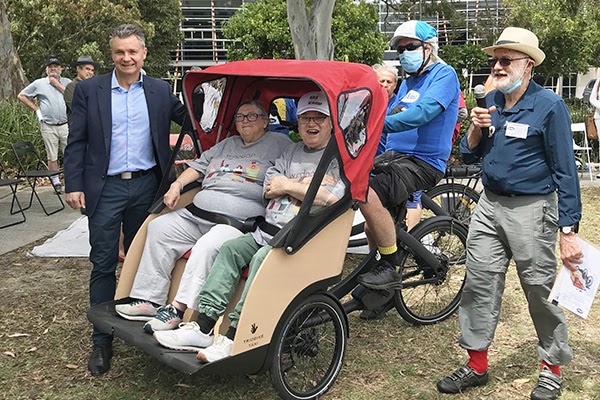Adrian Boss (far right) at the Cycling Without Age Trishaw Launch 2021