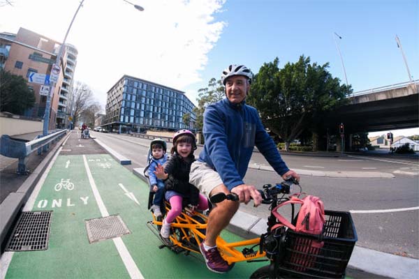 A family enjoying the Miller Street cycleway in Sydney (Source: City of Sydney)