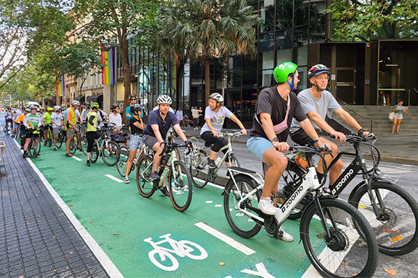 Participants in the Better Streets Walk + Ride in March 2023, many on e-bikes (Photo: Better Streets NSW)